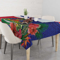 Blue rectangular tablecloth with red band, Haiti map stripe, and large hibiscus flowers
