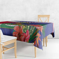 Close view of blue and red Haiti-themed tablecloth with tropical hibiscus floral motifs
