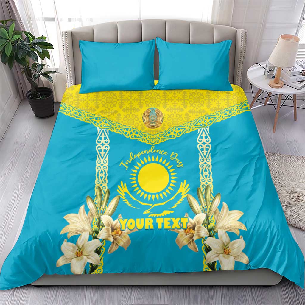 Blue and yellow bedding set on bed: duvet with sun emblem, lily flowers, two matching pillowcases