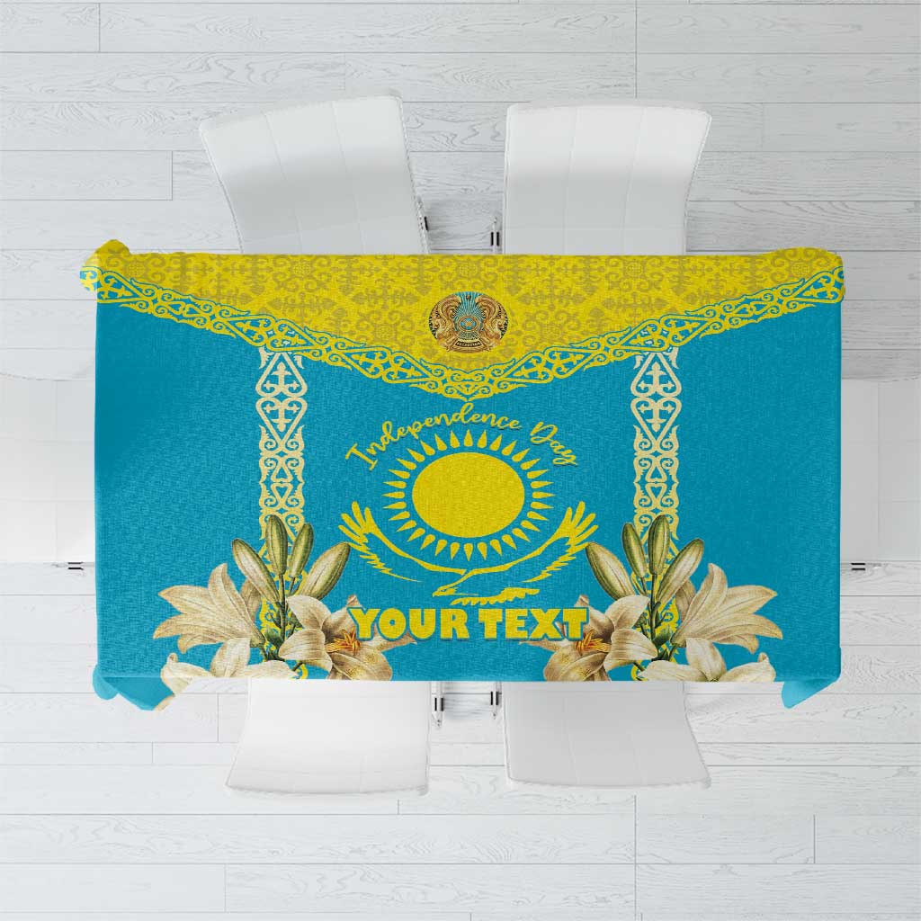 Blue tablecloth with yellow trim, central emblem and floral lilies, plus 'YOUR TEXT'.