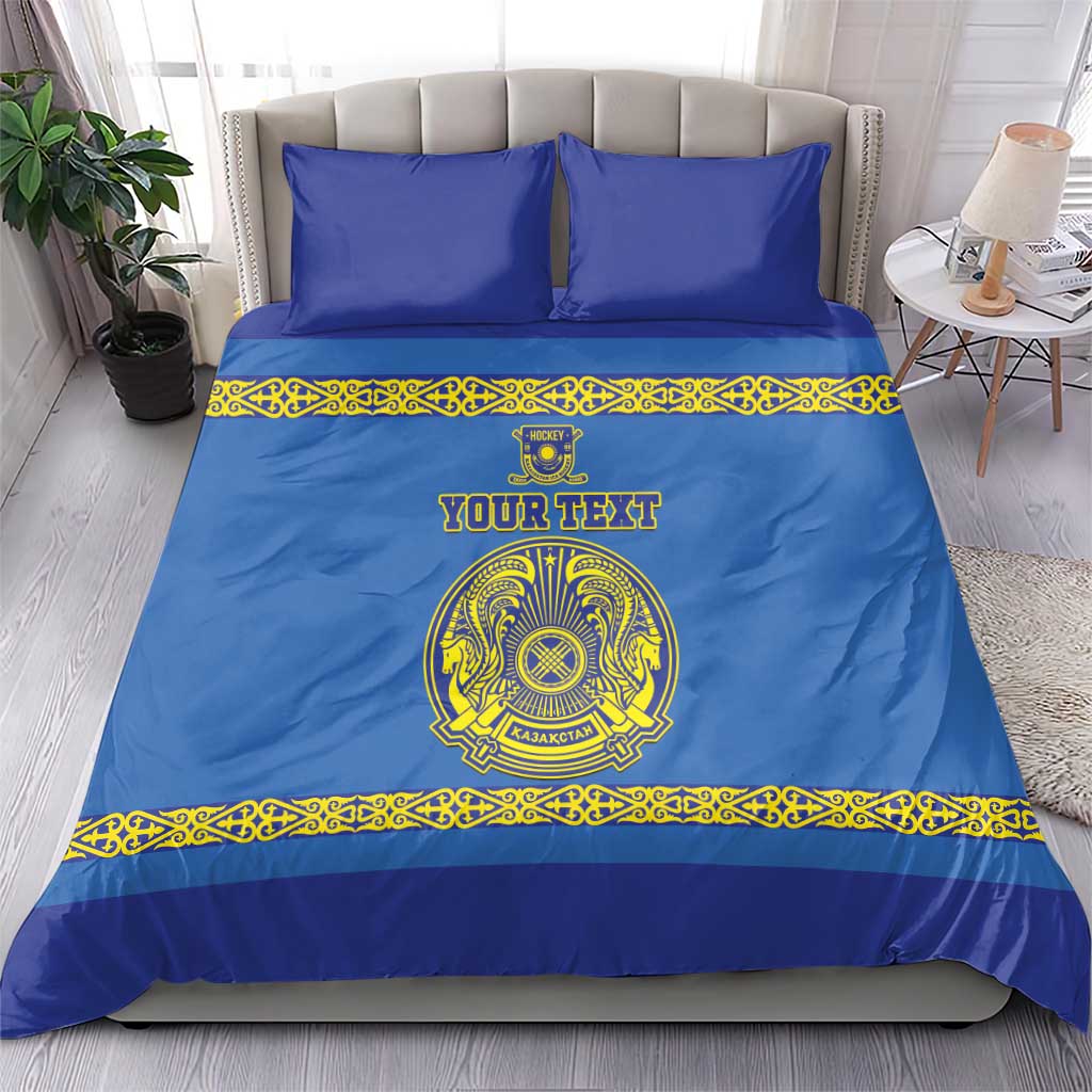 Blue duvet and matching pillows with yellow ornament border and central team crest