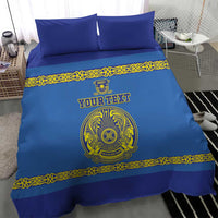 Blue bedding set showing duvet front with yellow border and crest motif
