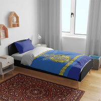 Blue and yellow crest bedding set on bed with matching pillow covers