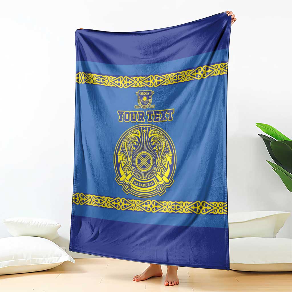 Blue custom hockey blanket draped with gold decorative trim, crest emblem and text panel