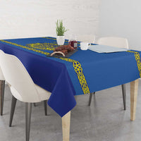 Blue hockey tablecloth with yellow patterned border, corner folds over table edge