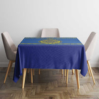 Blue hockey tablecloth with yellow border on small table between four chairs