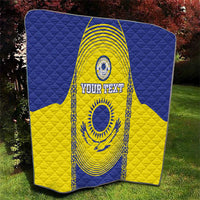 Custom Kazakhstan football quilt folded on grass, blue and yellow flag design with “YOUR TEXT”
