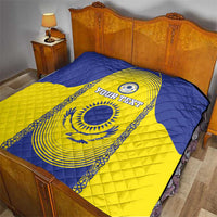 Custom Kazakhstan football quilt on a bed, blue and yellow with “YOUR TEXT” emblem
