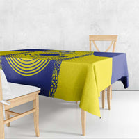 Printed tablecloth showing Kazakhstan flag in blue and yellow, draped on benches