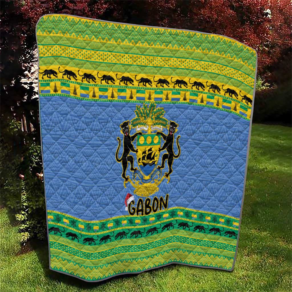 Blue quilt blanket with Gabon coat of arms center and green patterned animal border bands.