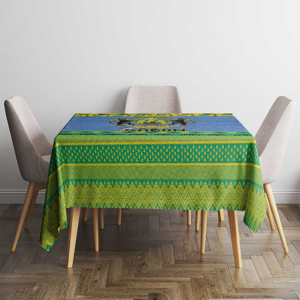 Blue and green Gabon crest holiday tablecloth on a square table