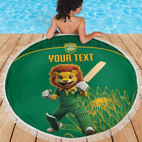 Green round beach blanket with lion cricket mascot holding a bat, 'YOUR TEXT' and fringe