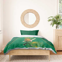 Green lion mascot duvet with “Your Text” and protea leaf motif on a wooden bed