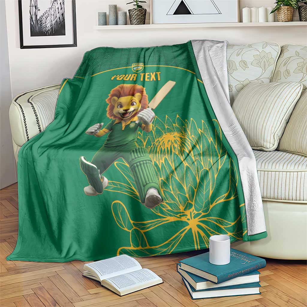 Green cricket blanket with lion mascot and 'YOUR TEXT' banner, botanical pattern