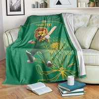Green cricket blanket with lion mascot and 'YOUR TEXT' banner, botanical pattern