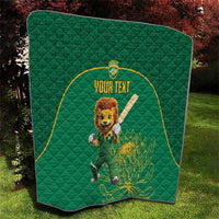 Green quilt blanket with lion mascot artwork, yellow-bordered circle, and custom text