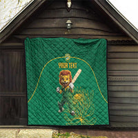 Green quilt blanket hanging on a barn wall, with lion mascot and yellow-bordered custom text
