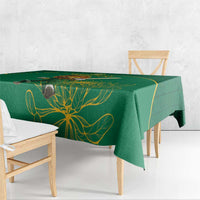 Green tablecloth with gold botanical pattern and straight drape over table