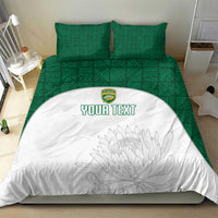 Green patterned bed set with white duvet, floral outline, and custom text in green
