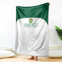 Custom cricket blanket with green backing and white front panel; crest, gray protea art, YOUR TEXT
