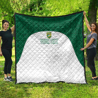 Cricket quilt laid outdoors: green patterned edge, white shield panel, “YOUR TEXT”