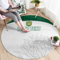 Round white cricket-themed rug with green ring border, crest logo, gray leaf design, 'YOUR TEXT'.