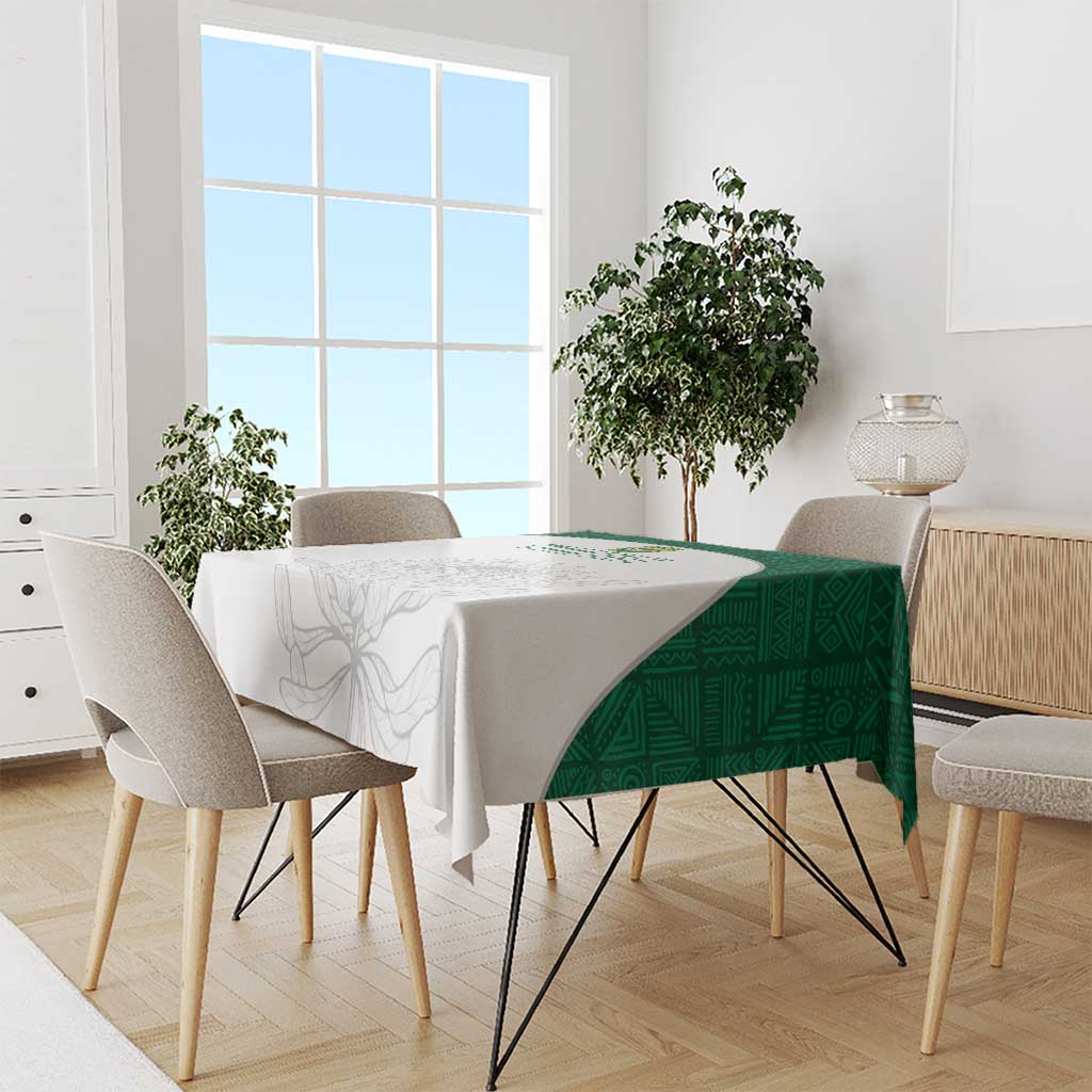 Rectangle cricket tablecloth with green patterned side and light floral design on table