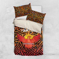 Orange and black bed set with eagle graphic, geometric pattern, and Eastern Cape text