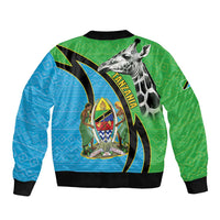 Unisex bomber jacket with green/blue geometric pattern, giraffe print, and black ribbed hem