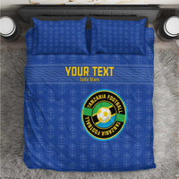 Blue duvet set with “YOUR TEXT” and circular Tanzania Football logo centered, two pillows.