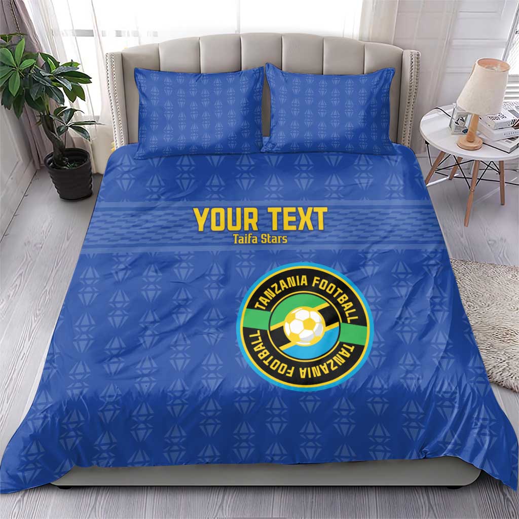 Blue bedding set with “YOUR TEXT” and Tanzania Football logo, two square pillowcases.