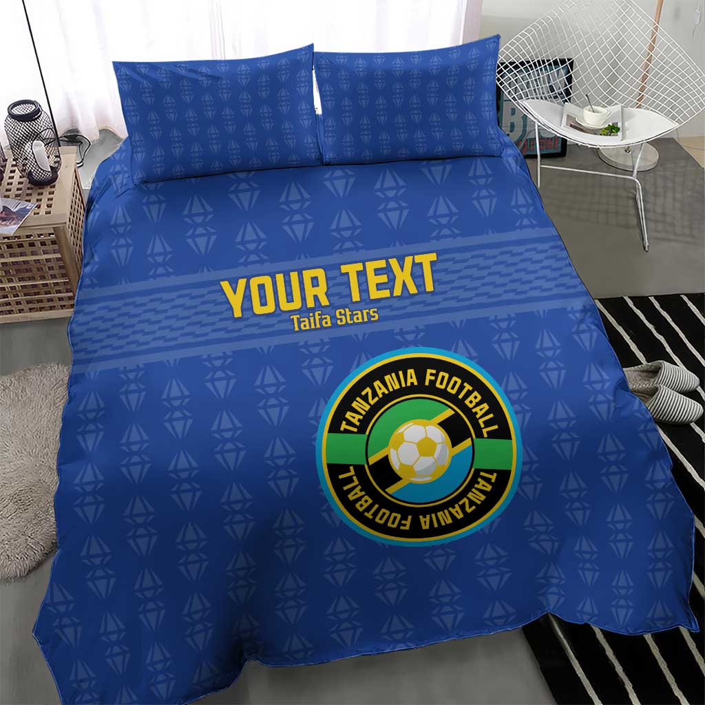 Blue duvet and pillowcases featuring “YOUR TEXT” and circular Tanzania Football crest.