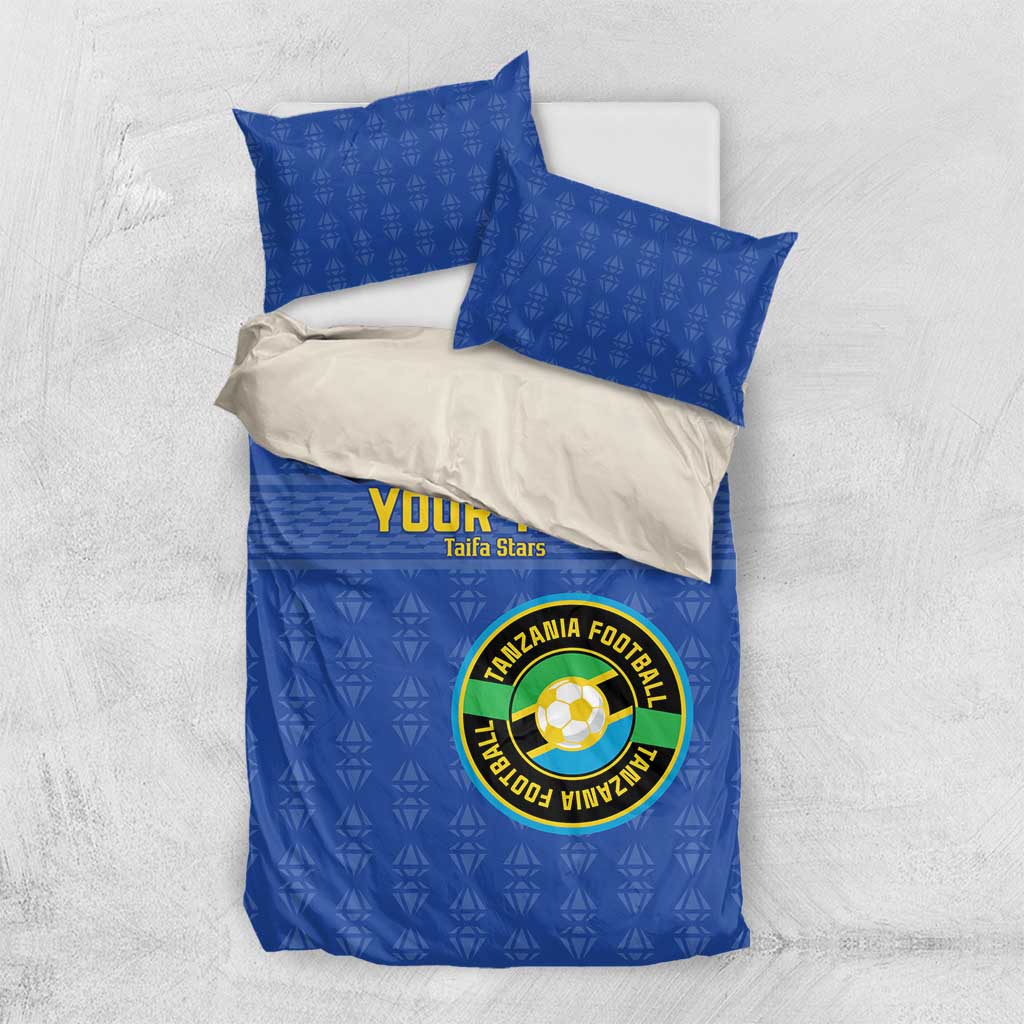 Blue football bedding set with circular Tanzania emblem, “YOUR TEXT” and matching pillows.