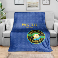 Blue football blanket with Tanzania logo, 'YOUR TEXT' text and geometric pattern