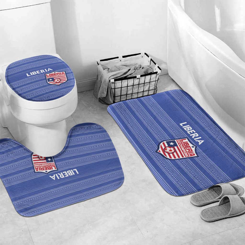 Liberia blue bathroom mat set with toilet lid cover on floor