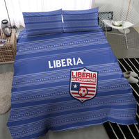Blue striped bedding set with Liberia emblem on duvet, two pillow shams