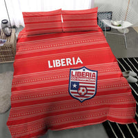 Red Liberia football bedding set with striped design; duvet and two pillows on bed