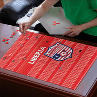 Red Liberia jigsaw puzzle with crest and 'LIBERIA' lettering on a flat surface