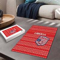Red Liberia jigsaw puzzle with crest and lettering, shown with matching white puzzle box