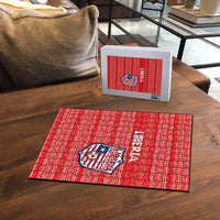 Red Liberia jigsaw puzzle with crest and lettering, displayed with white puzzle box