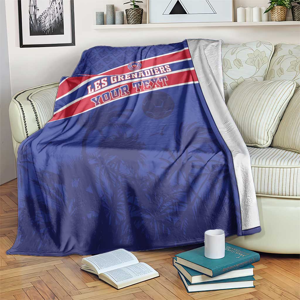 Blue football blanket with red-and-white stripe and team emblem, draped with gray backing