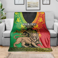 Personalized Ethiopia lion blanket on a sofa, green red black tribal pattern