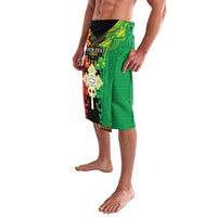 Green African wrap skirt with colorful cross and lion graphic, side view, knee length