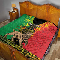 Personalized Ethiopia quilt blanket on bed, green and red panels with lion of Judah center graphic