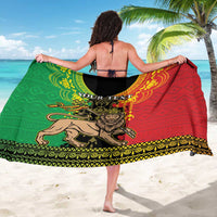 Red and green Lion of Judah sarong, 'YOUR TEXT' across center, gold patterned hem