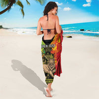 Red and green Lion of Judah sarong draped back, 'YOUR TEXT' near top