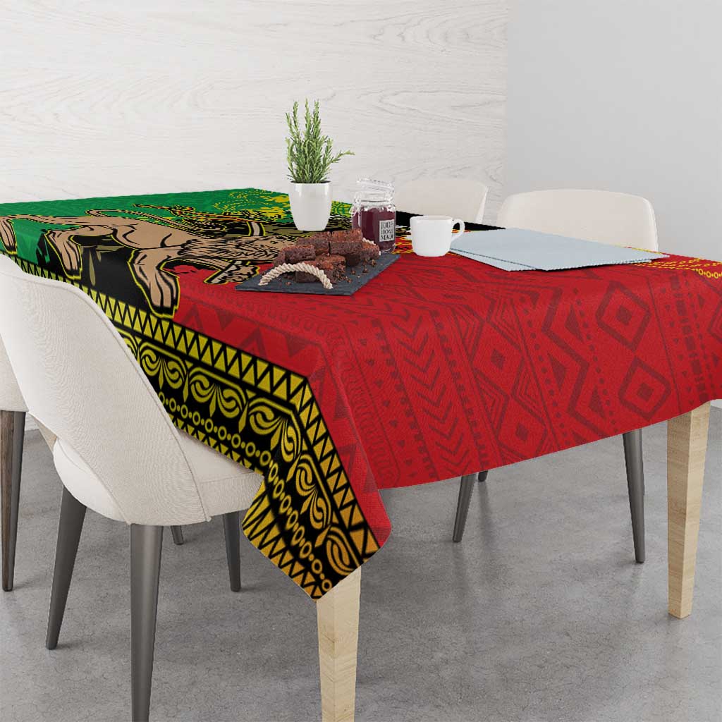 Ethiopia tablecloth draped on dining table, red and green Lion of Judah motif