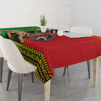 Ethiopia tablecloth draped on dining table, red and green Lion of Judah motif