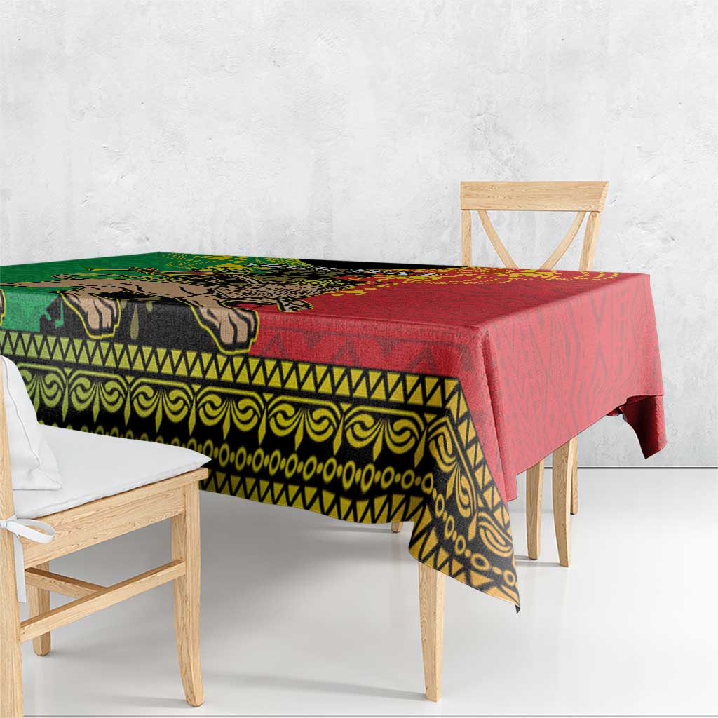 Ethiopia tablecloth on wooden table with patterned border, red and green Lion of Judah