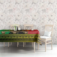 Ethiopia tablecloth over dining table, red and green Lion of Judah border with gold trim